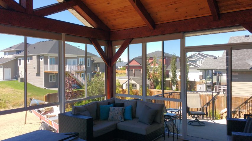 Grand Vista sunroom interior with cedar peaked ceiling looking out over the yard
